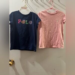 Polo Ralph Lauren girl’s pink and navy blue t-shirts.
